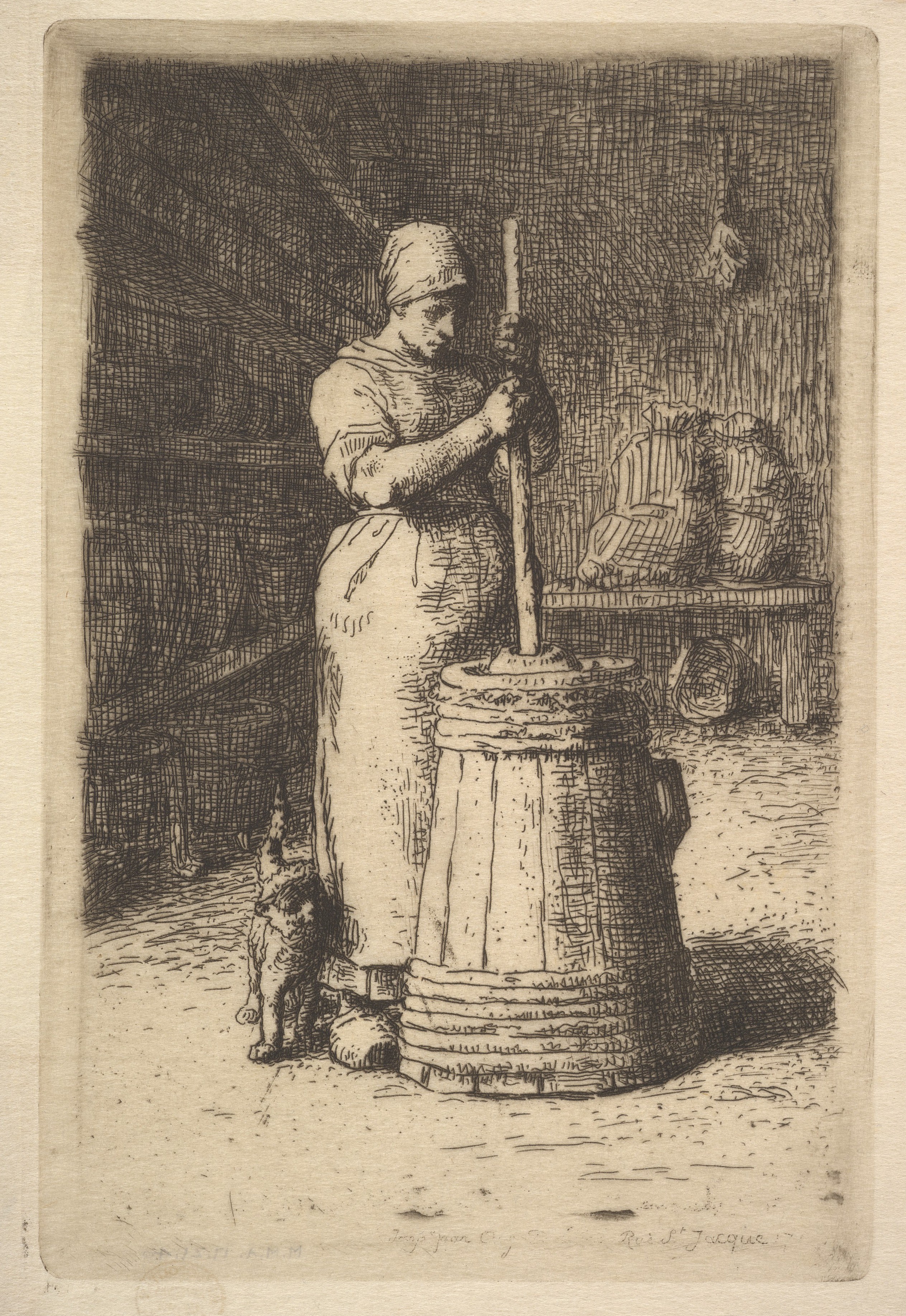 A woman in an apron and head bandana uses a butter churn. A small cat rubs against her leg.