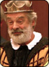 A photo of Don Allison as King Leir. Leir is a white man with grey hair and a full beard. He is wearing a crown.