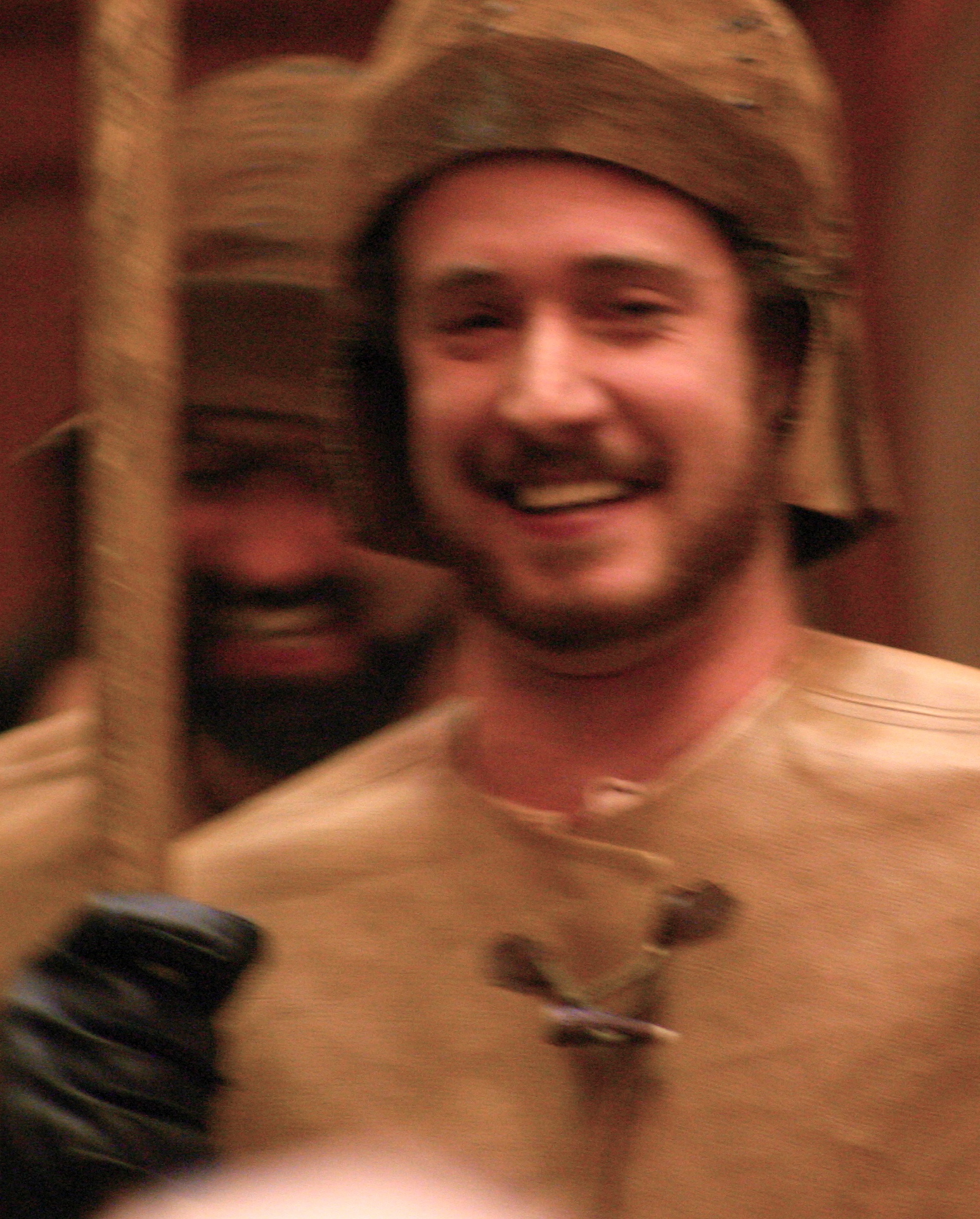 A photo of two smiling watchmen with one in the foreground and one in the background